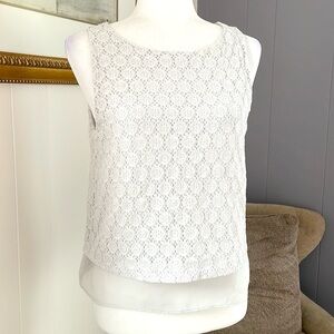 Sleeveless blouse with textured fabric